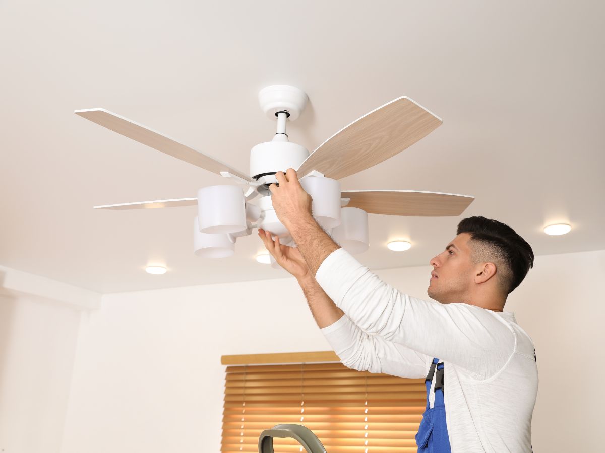 ceiling fan3 man installing a ceiling fan